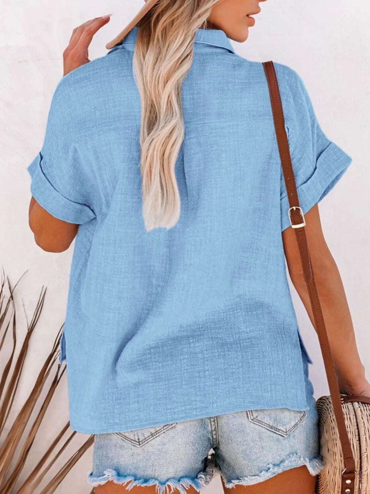 Sky blue button up shirt detail view