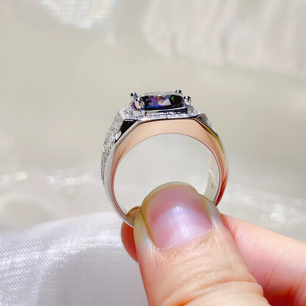 Close up of blue moissanite stone in silver setting