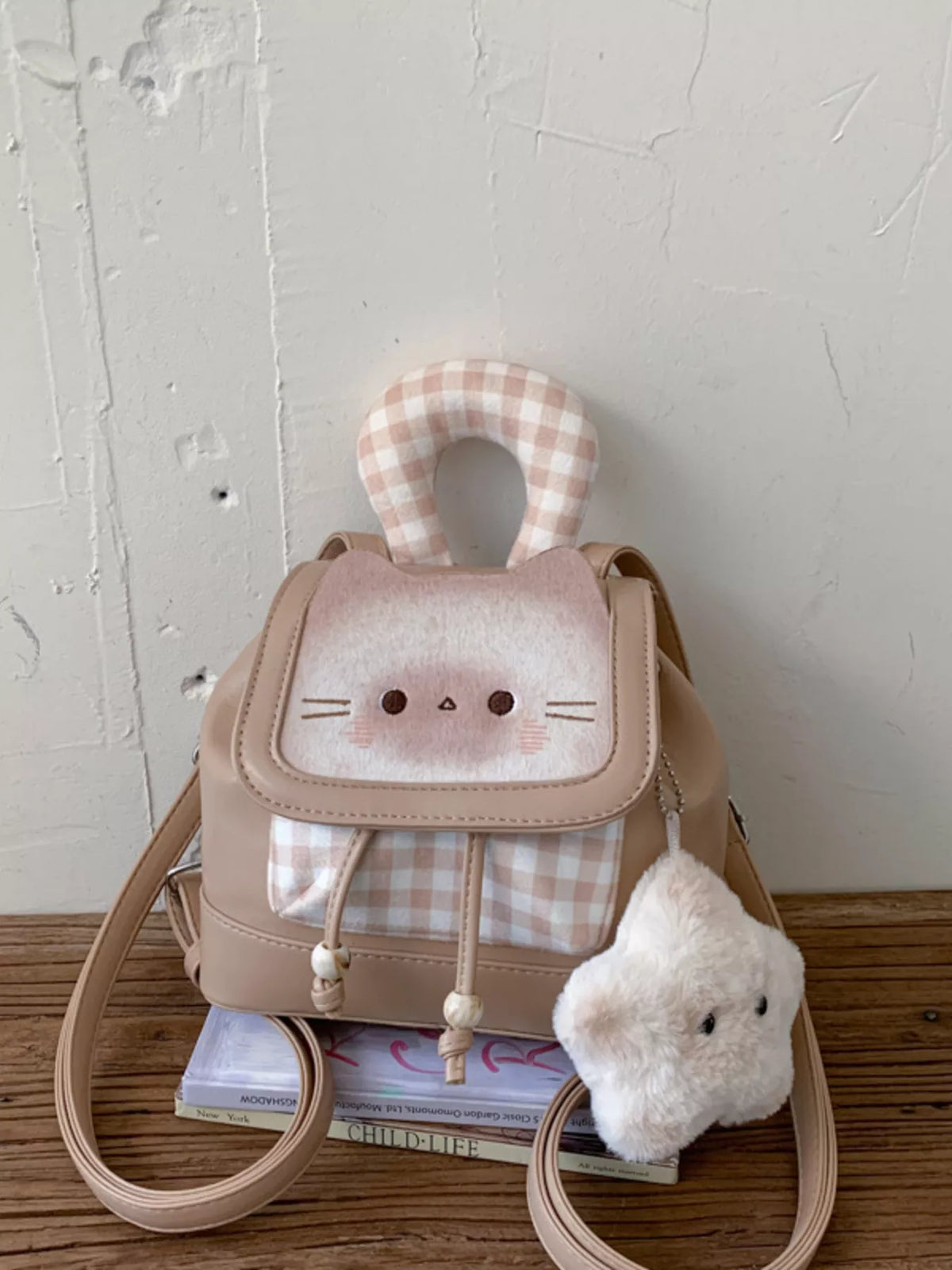 Cat plaid design detail on mini backpack