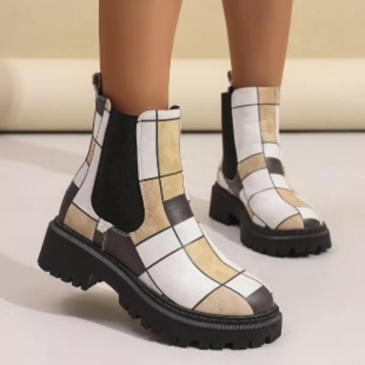 Round toe chunky heel ankle boots close up texture