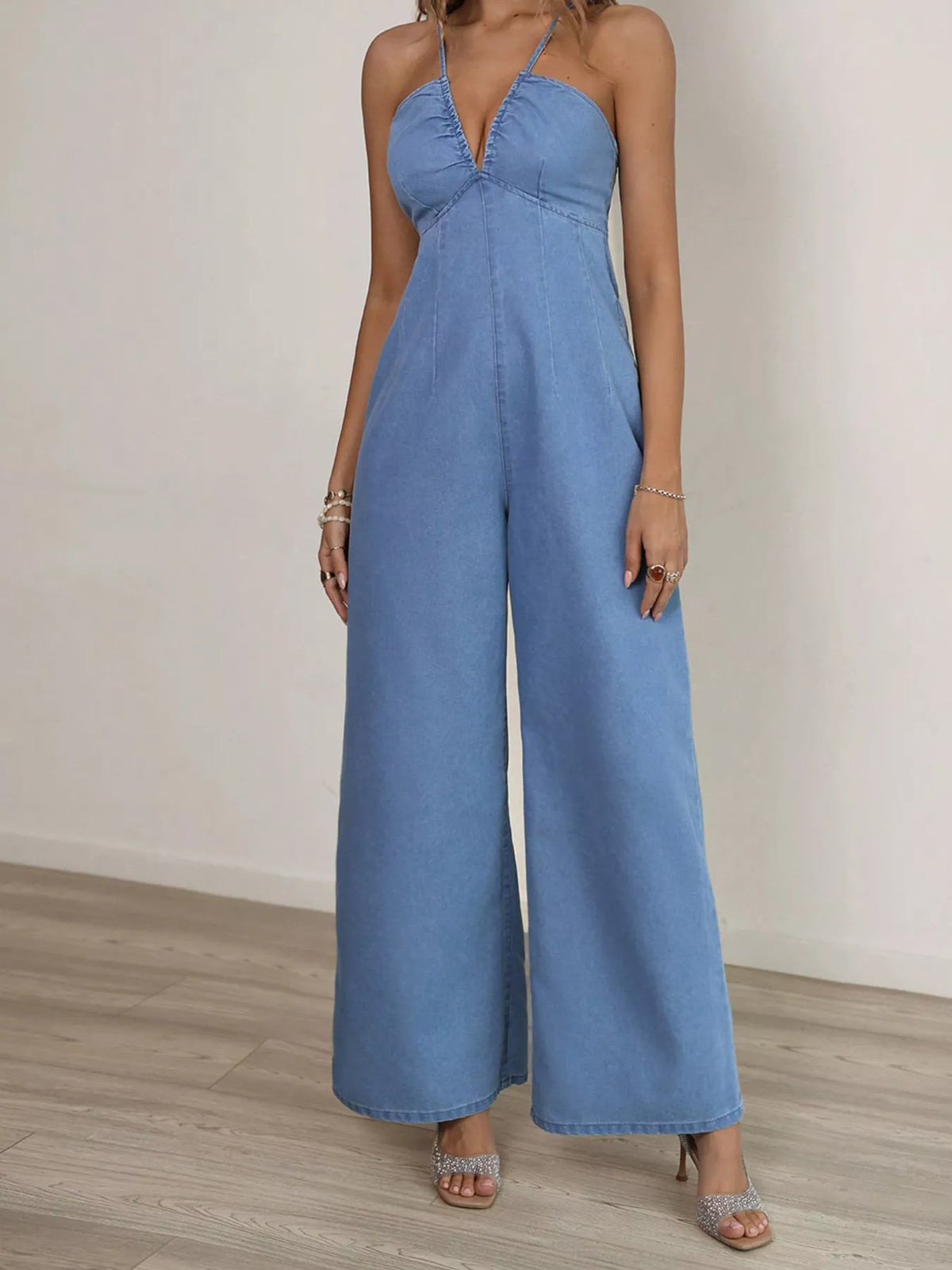 Back view of the blue wide leg denim jumpsuit
