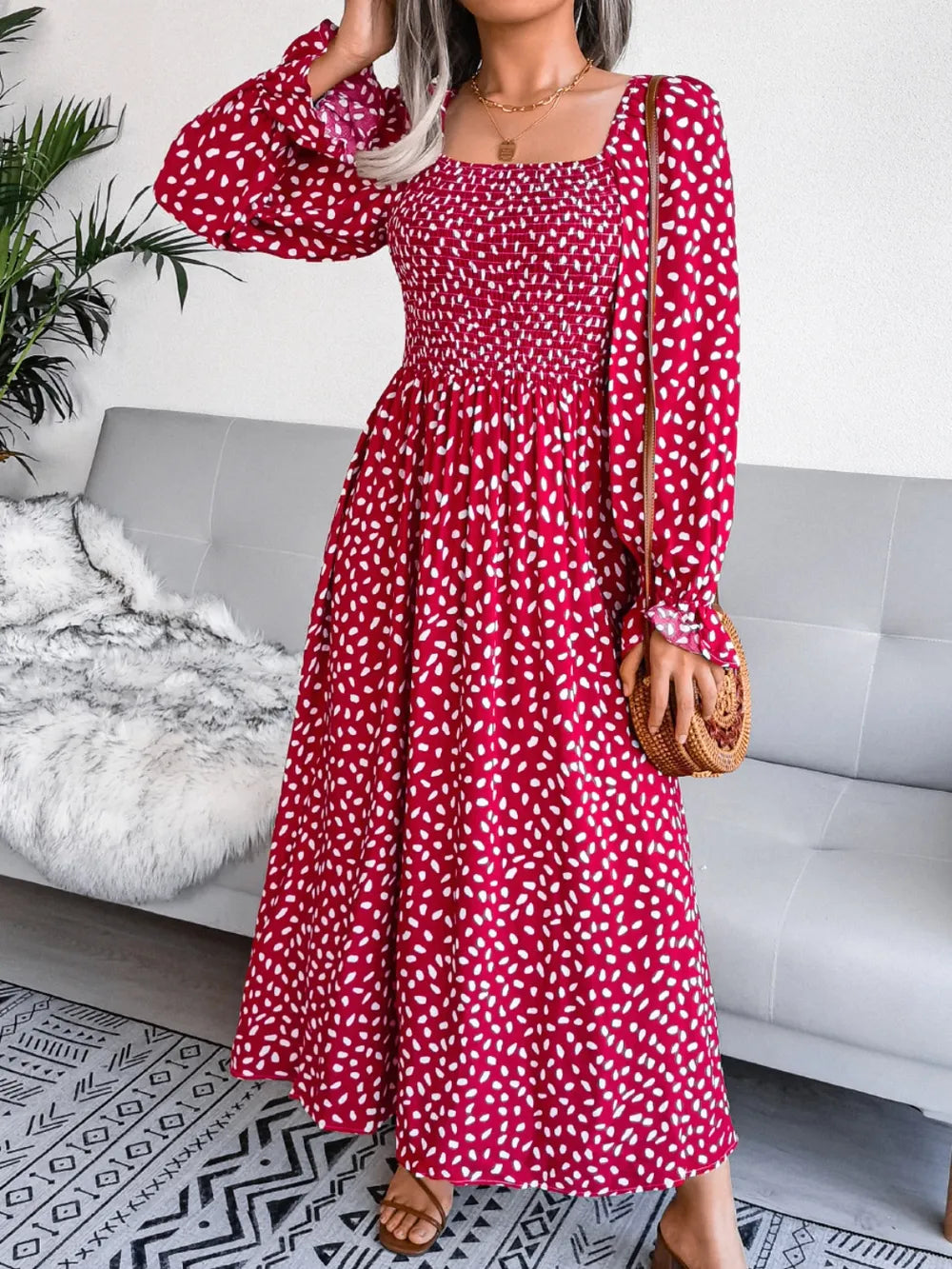 Smocked square neck flounce sleeve dress detail of the hem