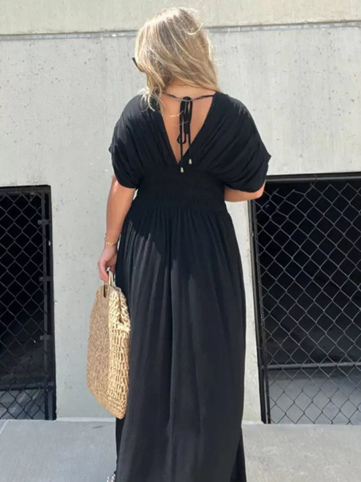 Slit V neck smocked waist maxi dress three quarter view
