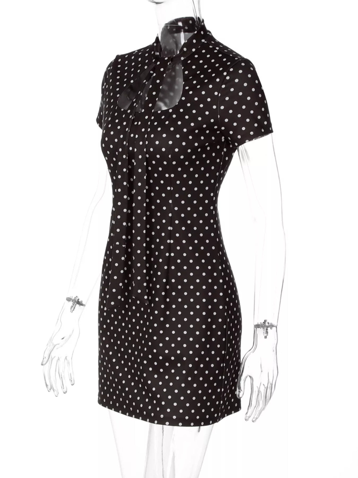 Brown polka dot mini dress shown from the back
