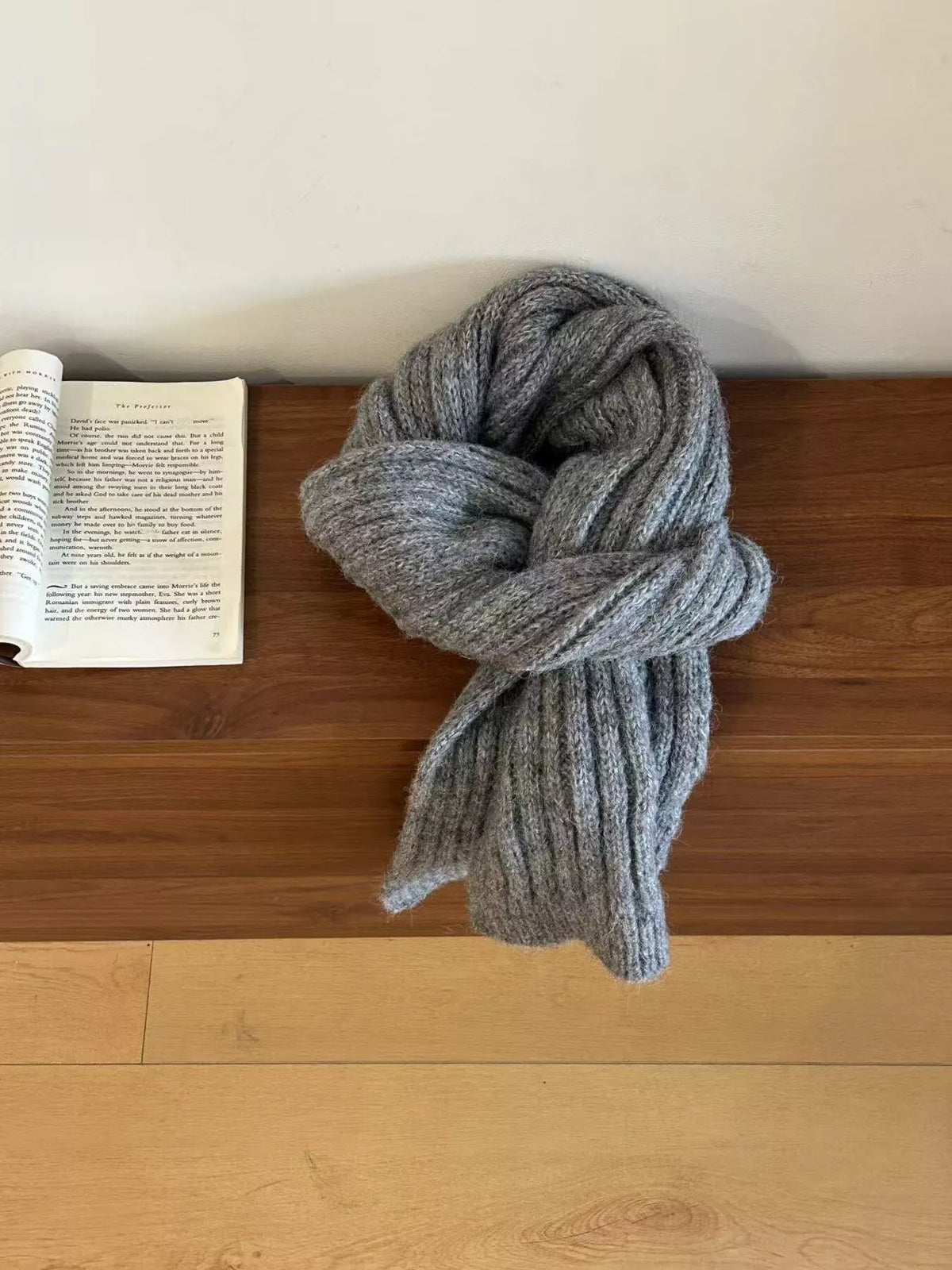 Knitted wool scarf draped around the neck