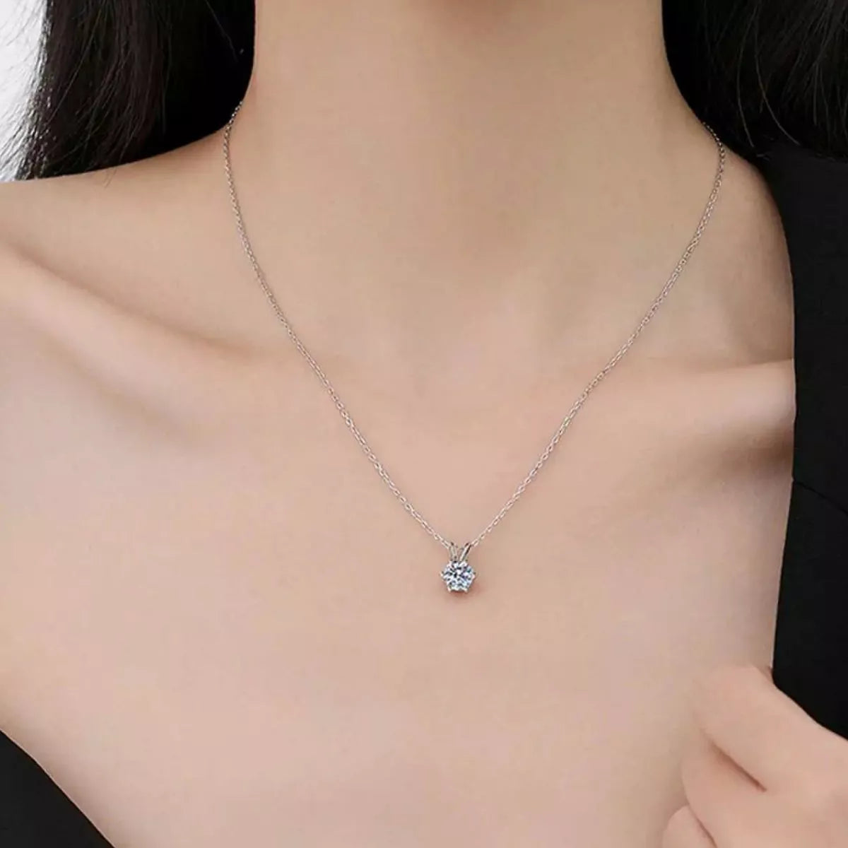 2 carat round moissanite pendant necklace worn on the collarbone