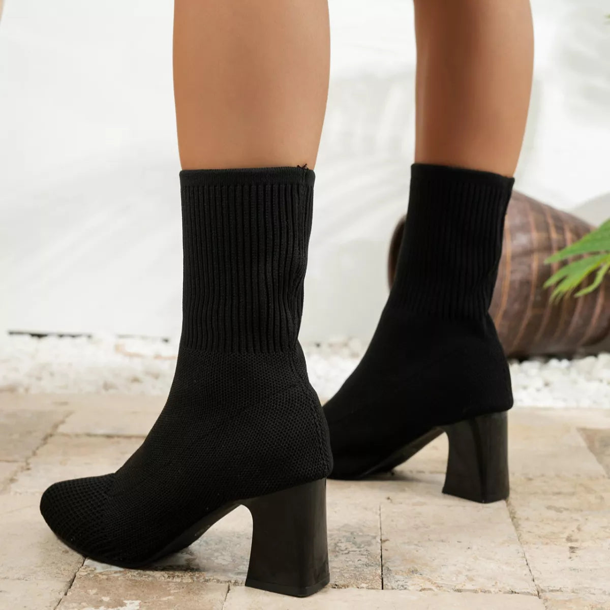 Pointed Toe Knit Sock Boots pair on a plain backdrop
