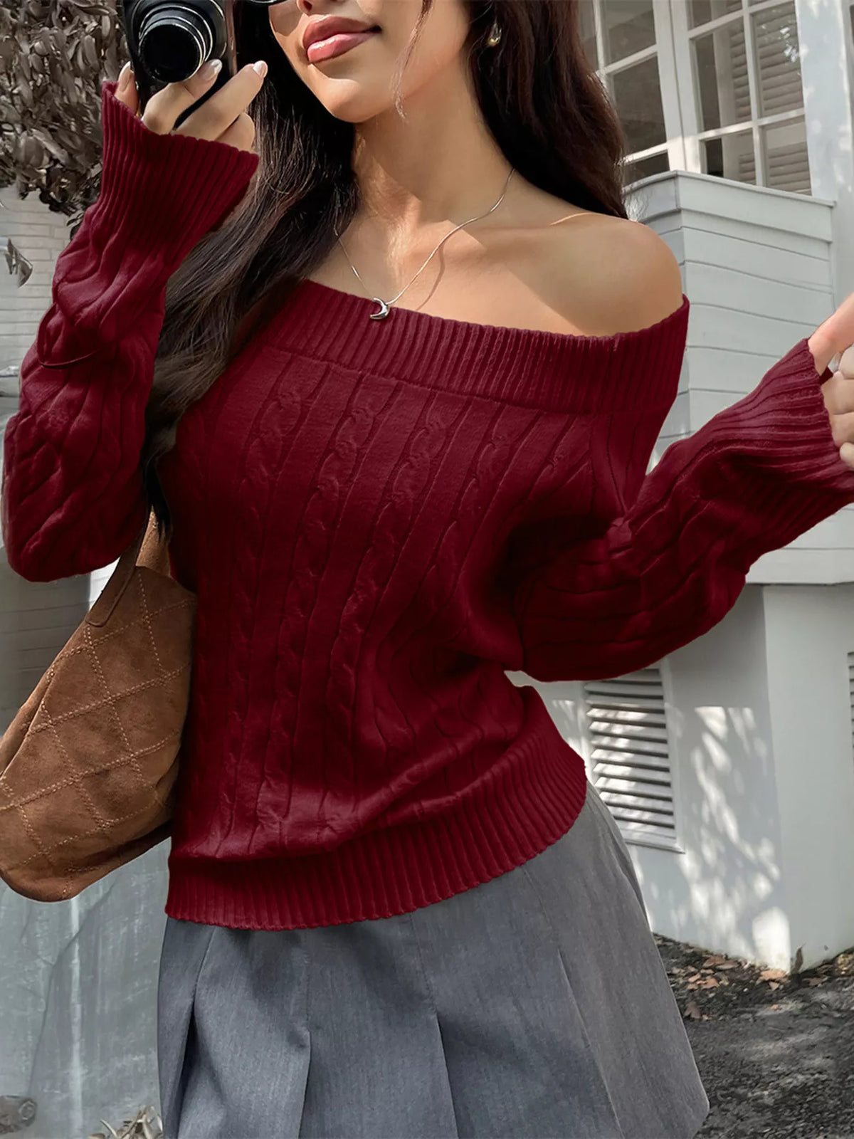 off shoulder cable knit sweater close up of the neckline