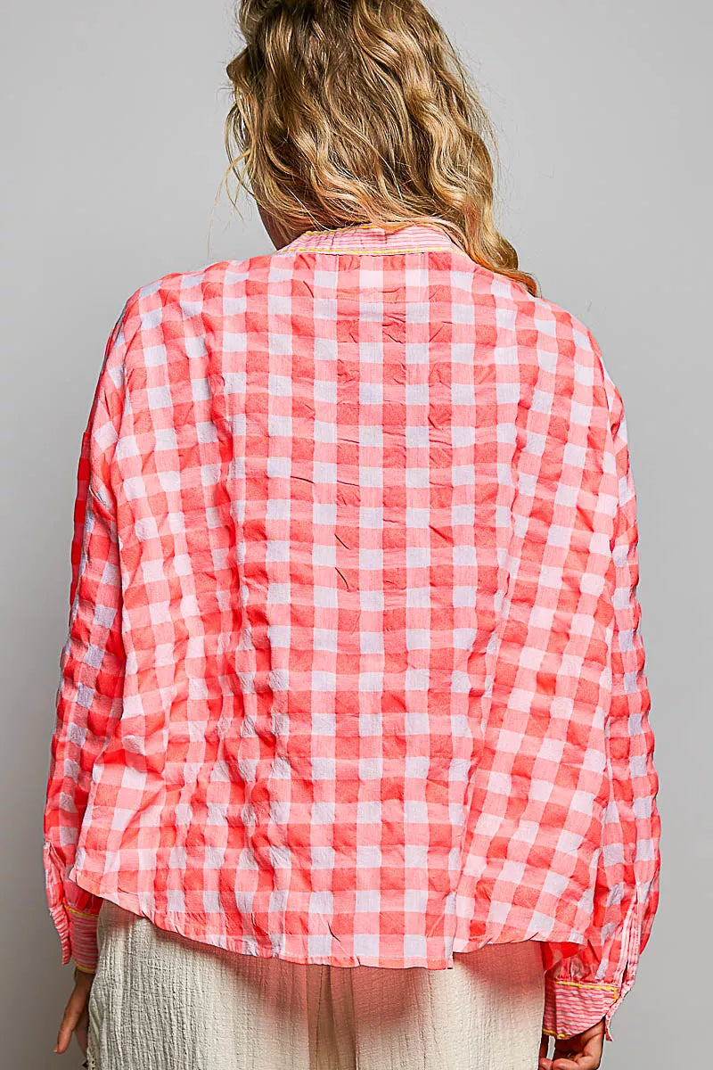 Button front and lace detail on the cotton blouse