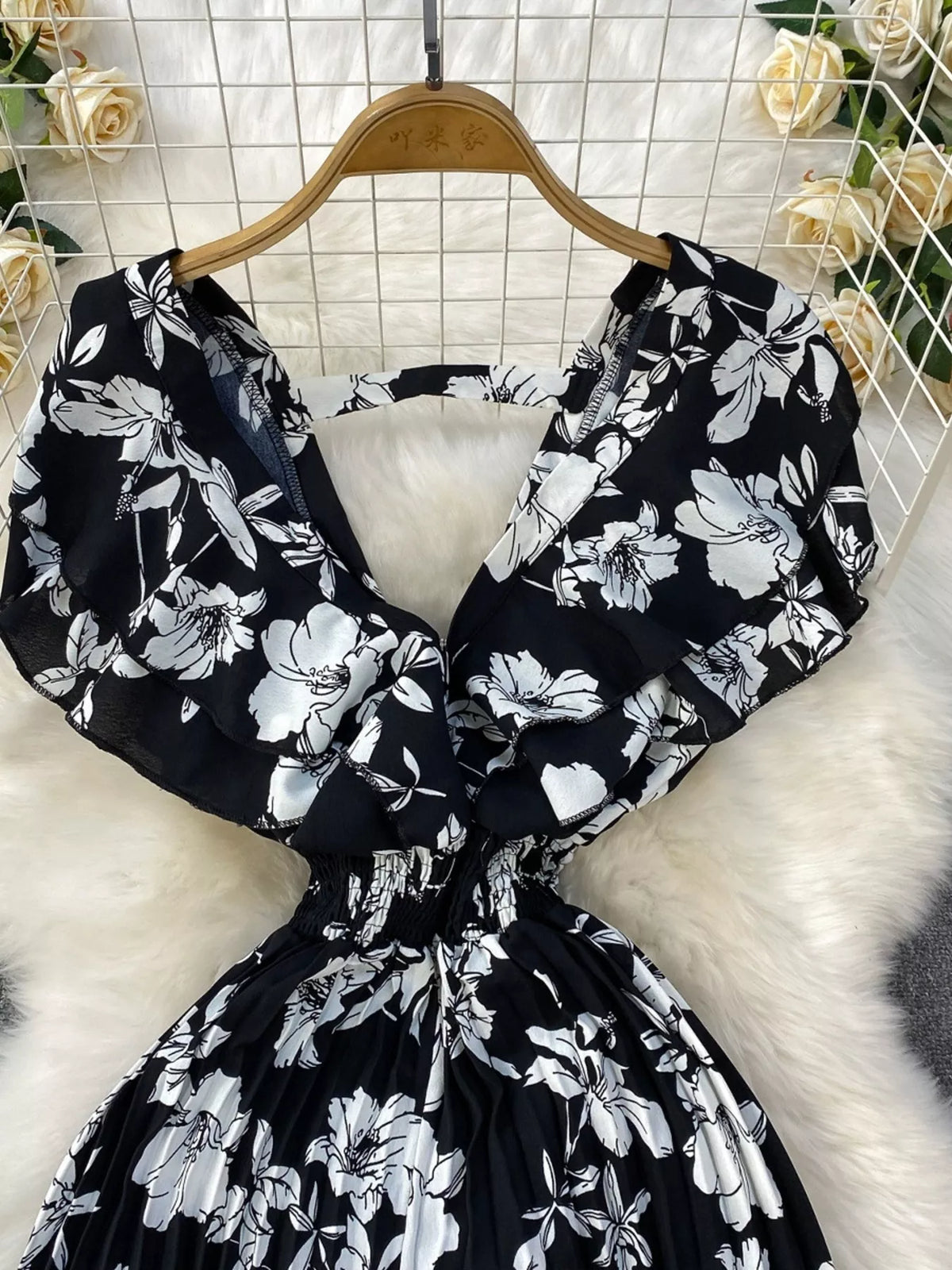 Floral print wide leg pleated jumpsuit detail view