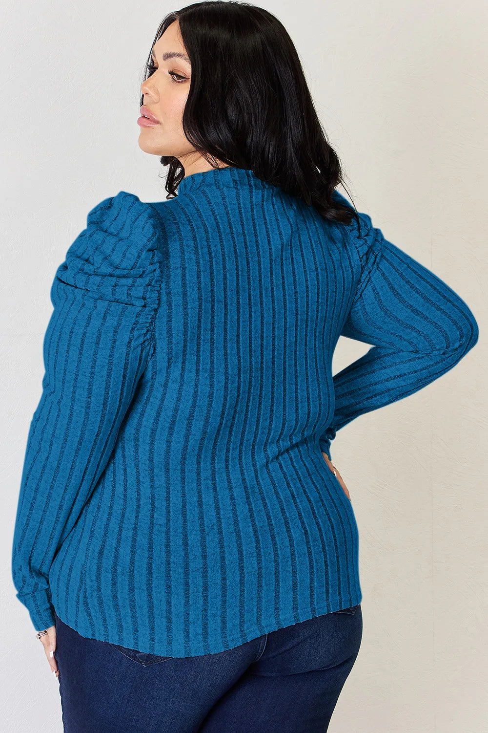 Puff sleeve mock neck top standing pose