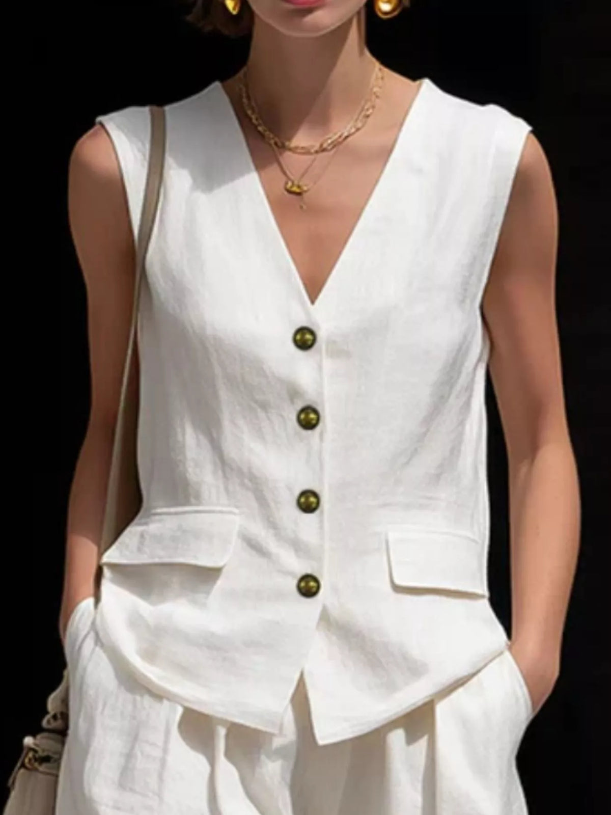 Sleeveless buttoned vest and matching shorts set shown from the side