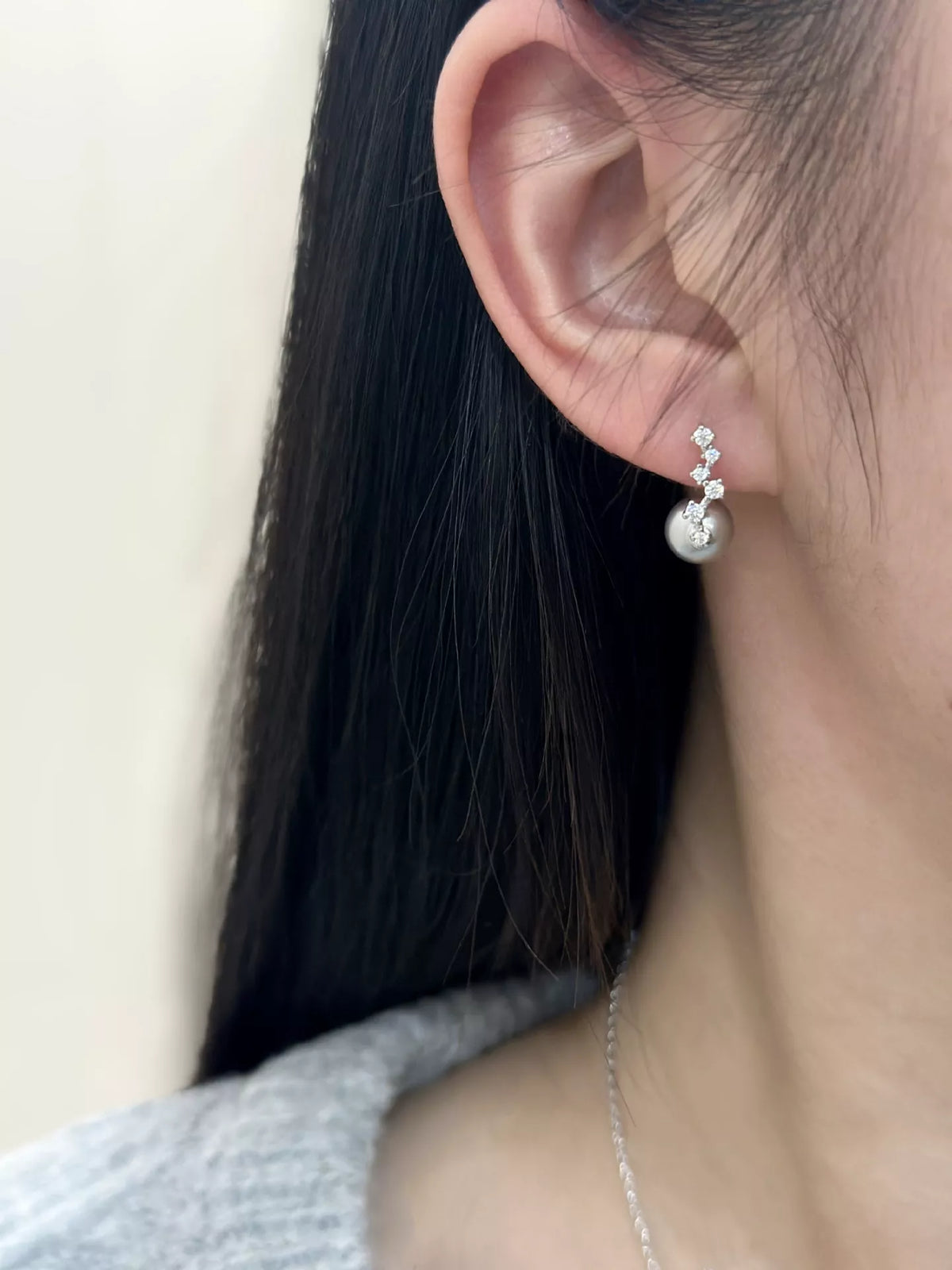 Sterling silver zircon earrings pair flat lay