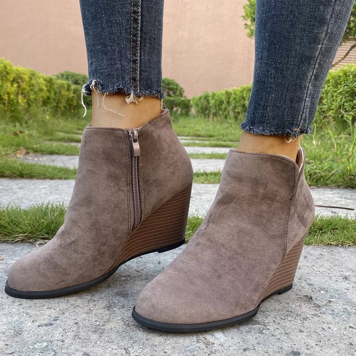 Round toe wedge ankle boots angled studio view