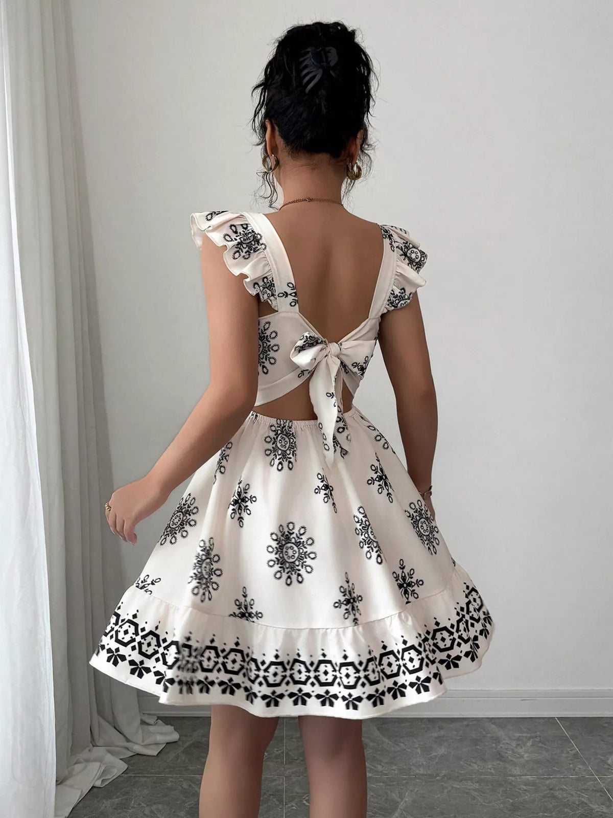 Printed mini dress shown from the side