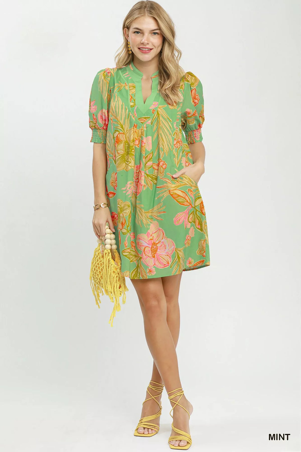 Mint botanical print boho dress with smocked cuffs front view