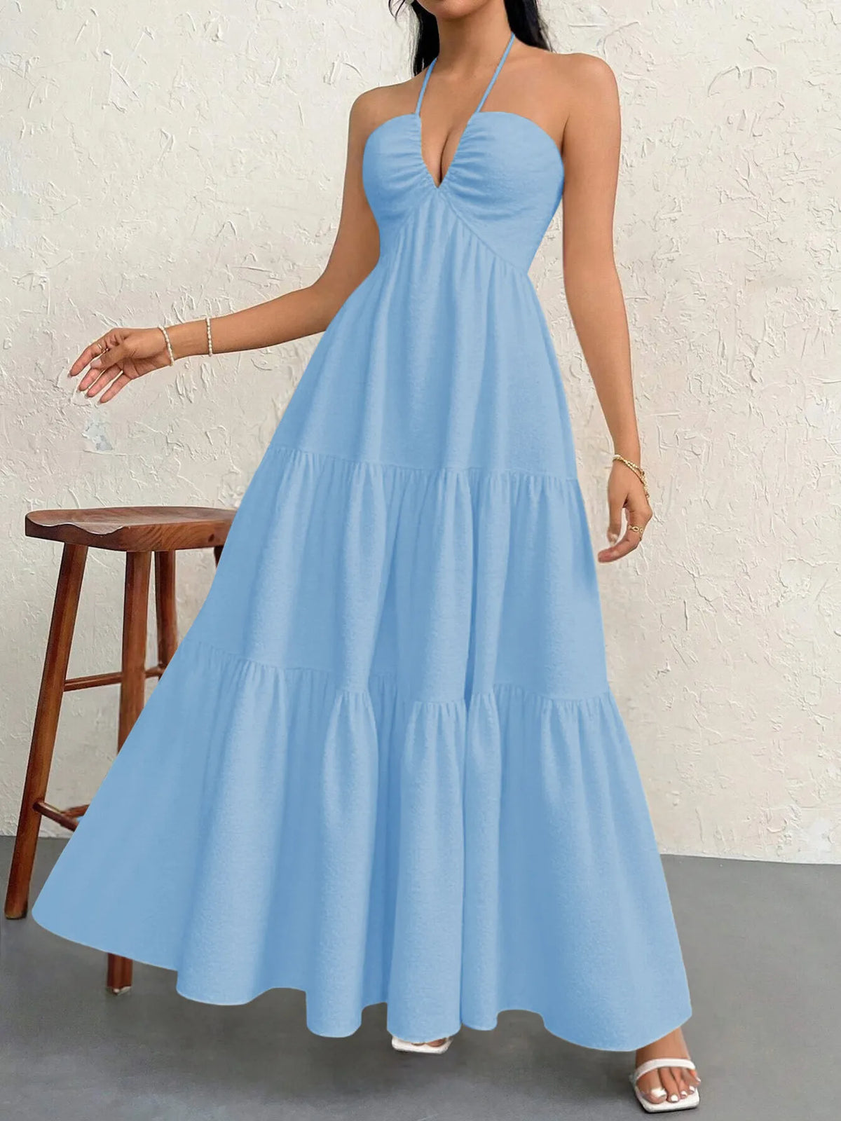 halter neck tiered backless maxi dress standing pose