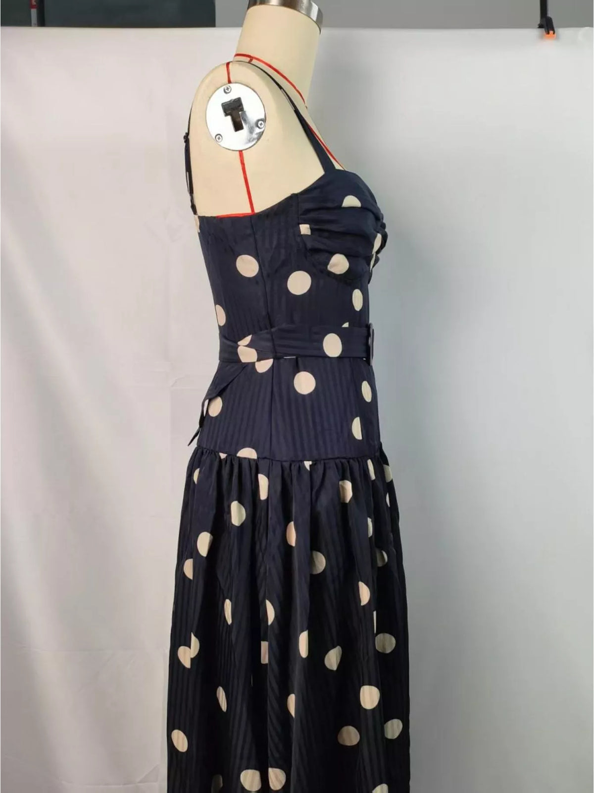 Black polka dot sweetheart neck midi dress back view