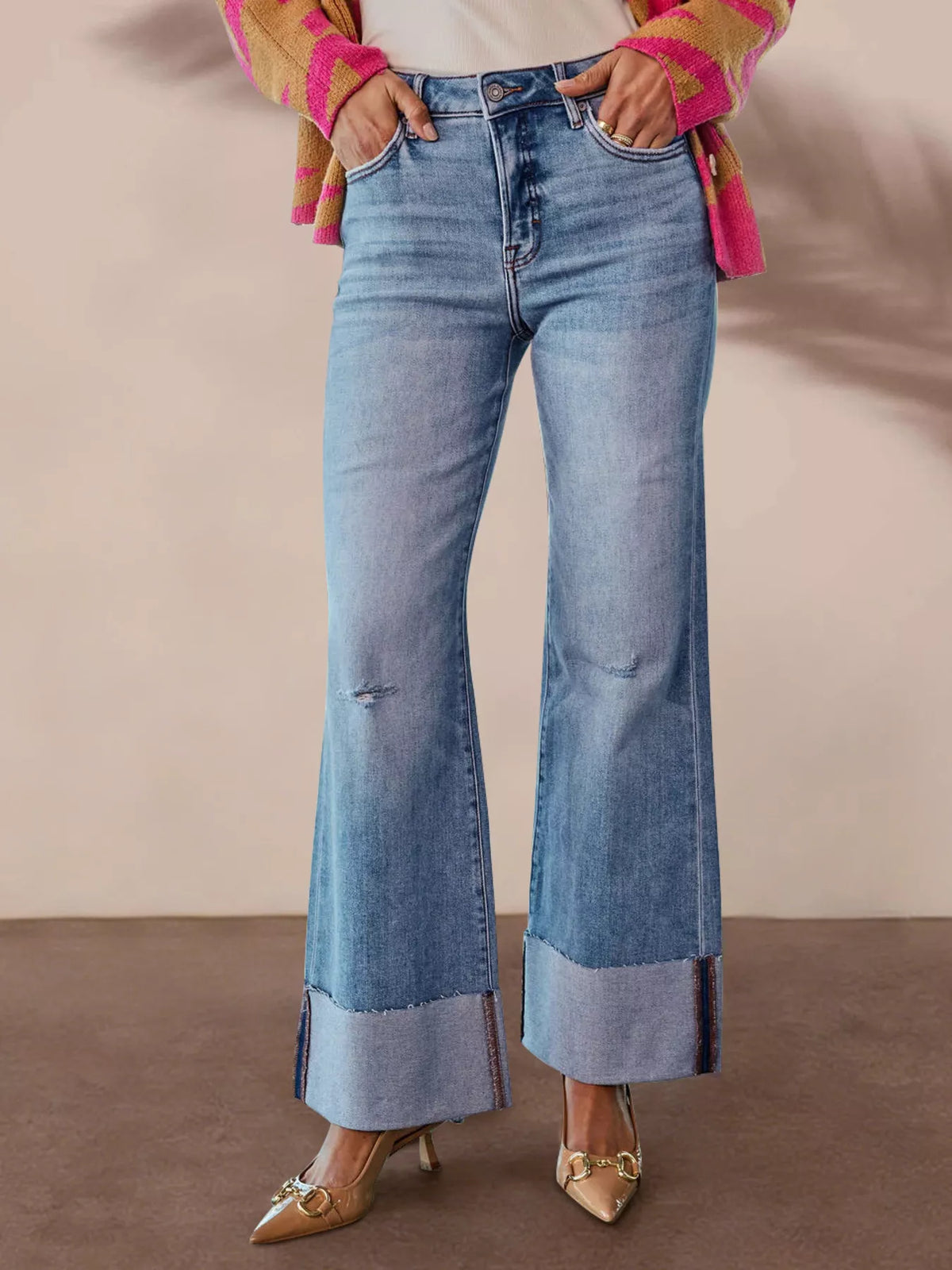 Blue distressed high waisted flare jeans front view