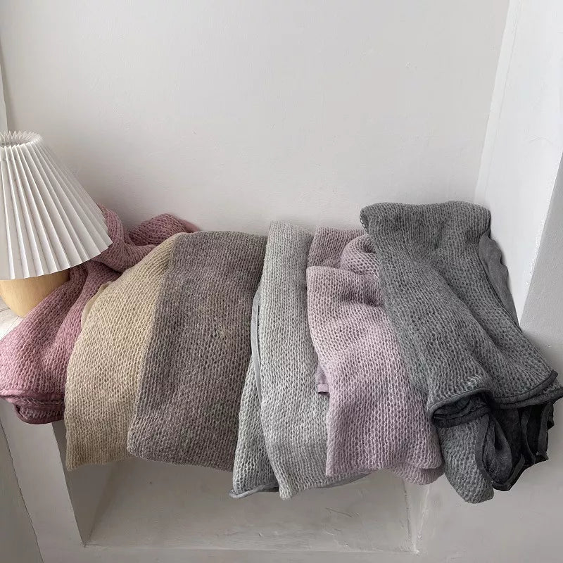 Lightweight knitted scarf styled over a top