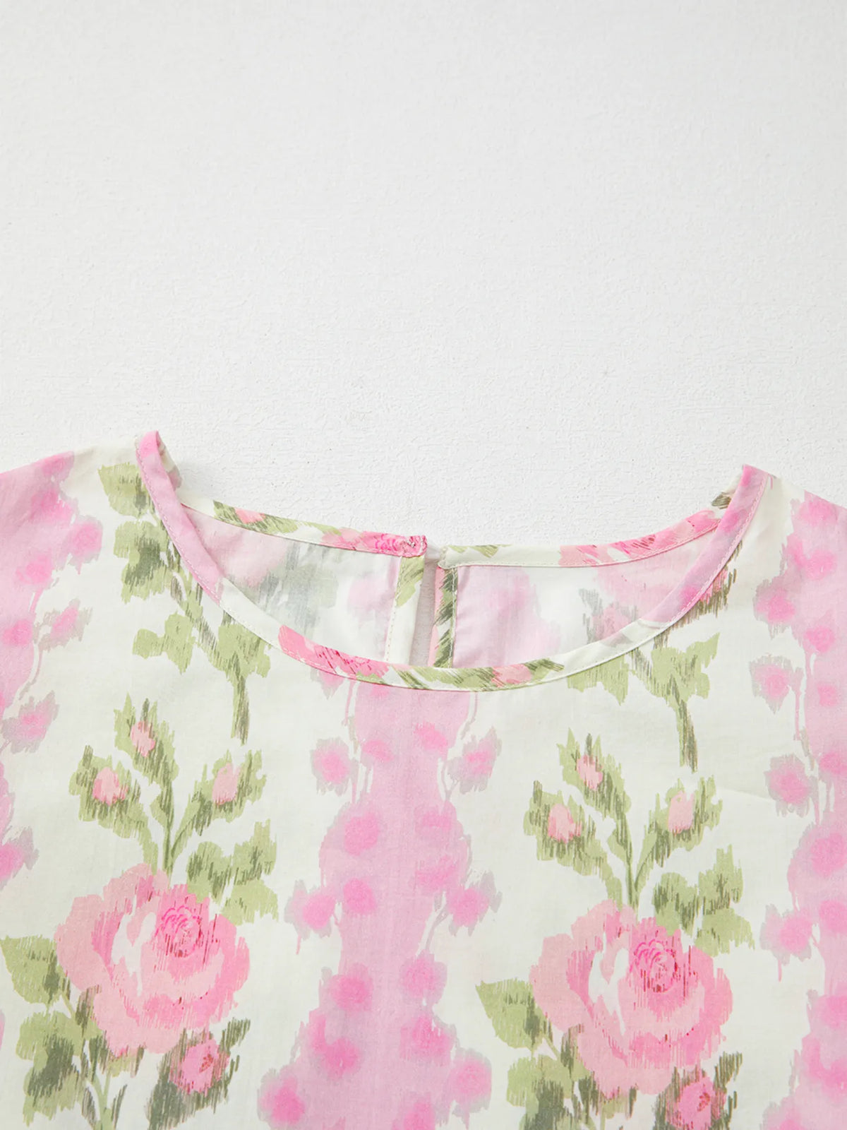 Floral print blouse fabric texture detail