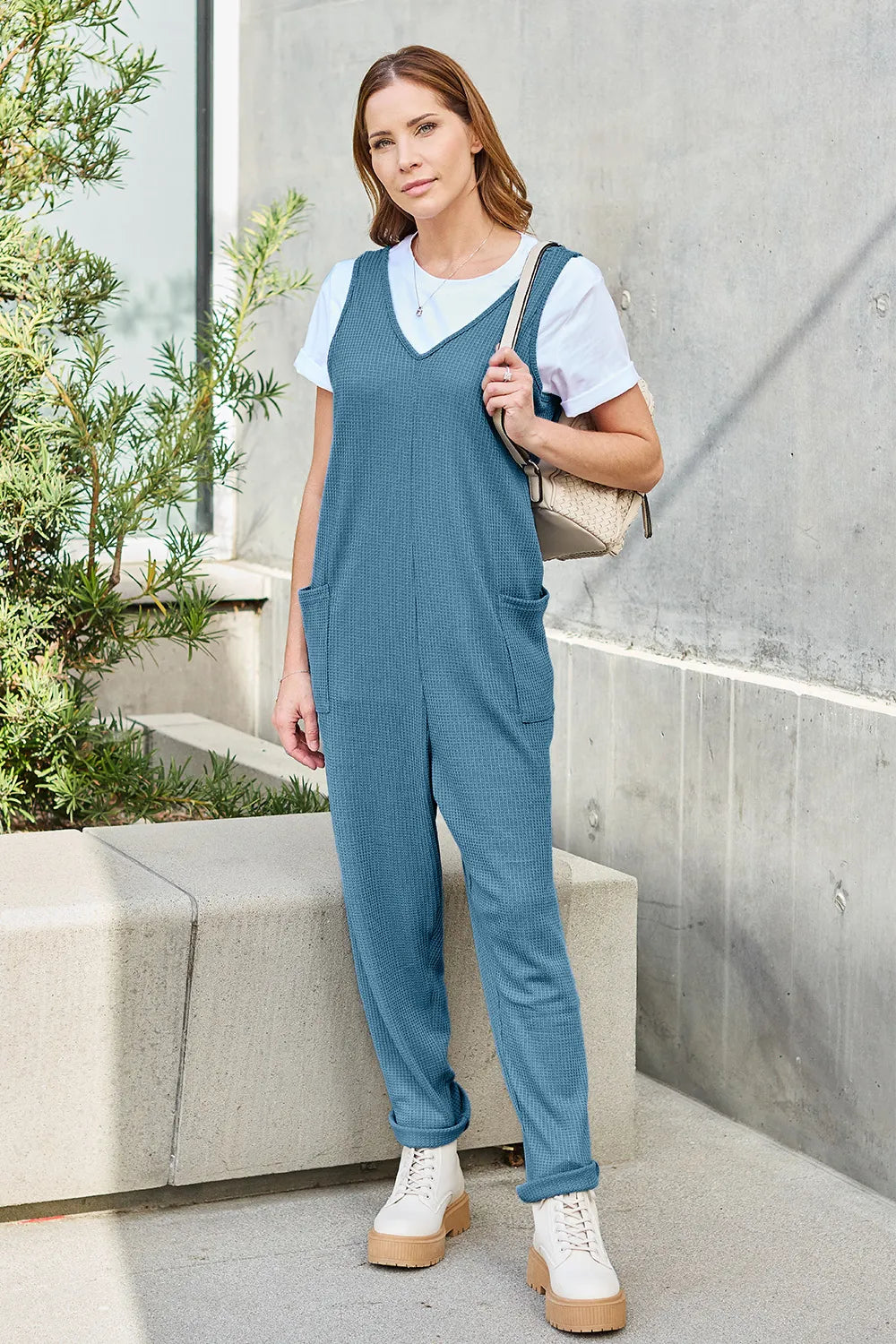 Sky blue straight leg jumpsuit side view