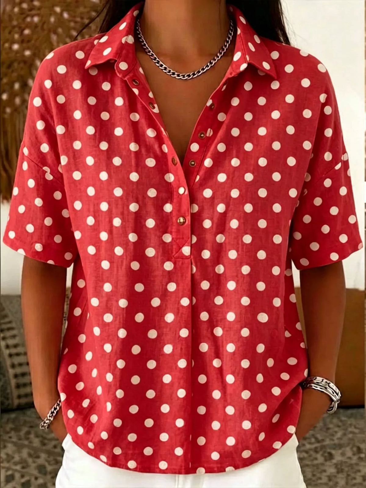 White polka dot shirt styled with trousers