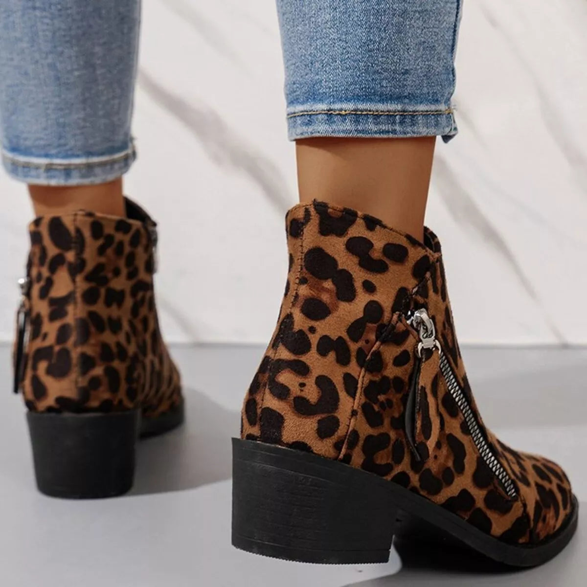 Black point toe block heels boots styled with denim