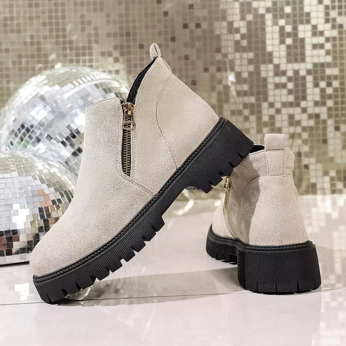 Round toe side zip ankle boots styled on model