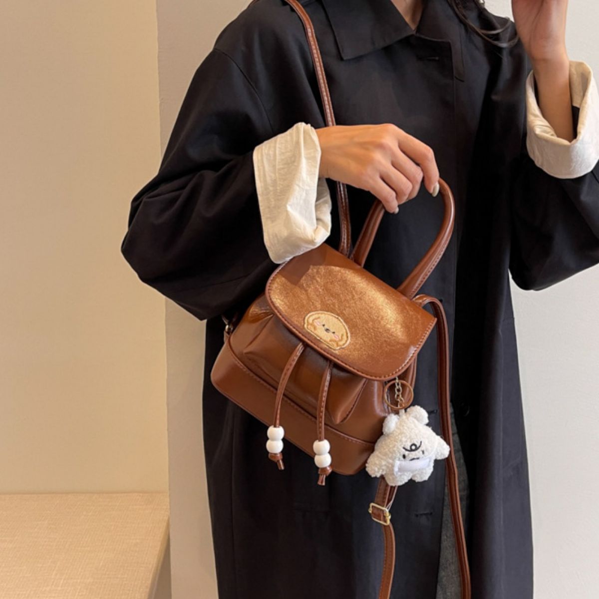 brown puppy patch mini backpack side profile