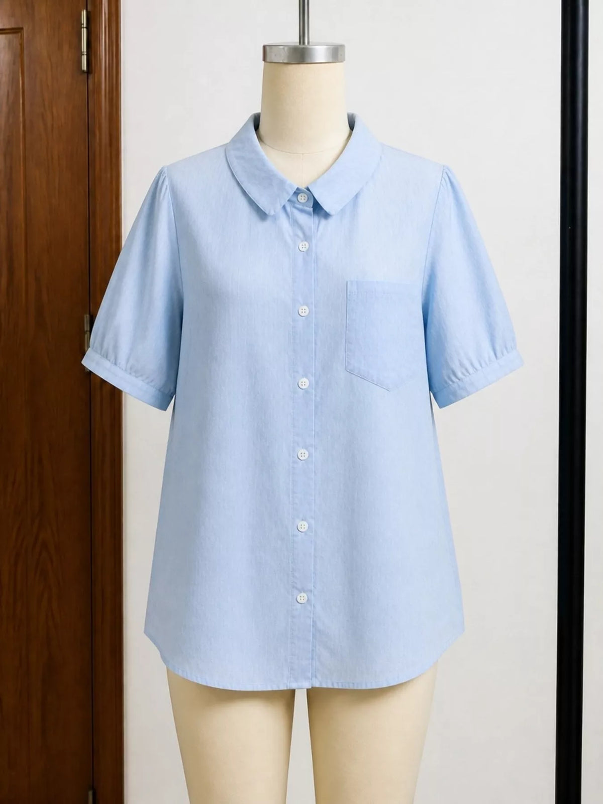 Short sleeve button up shirt shown from the back