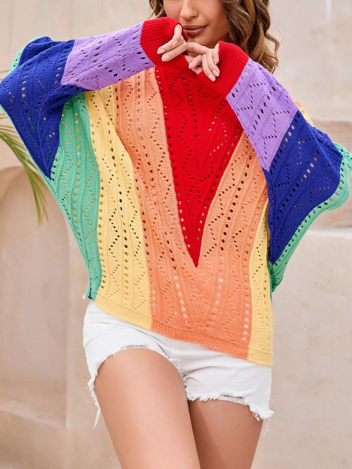 Model wearing color block openwork sweater