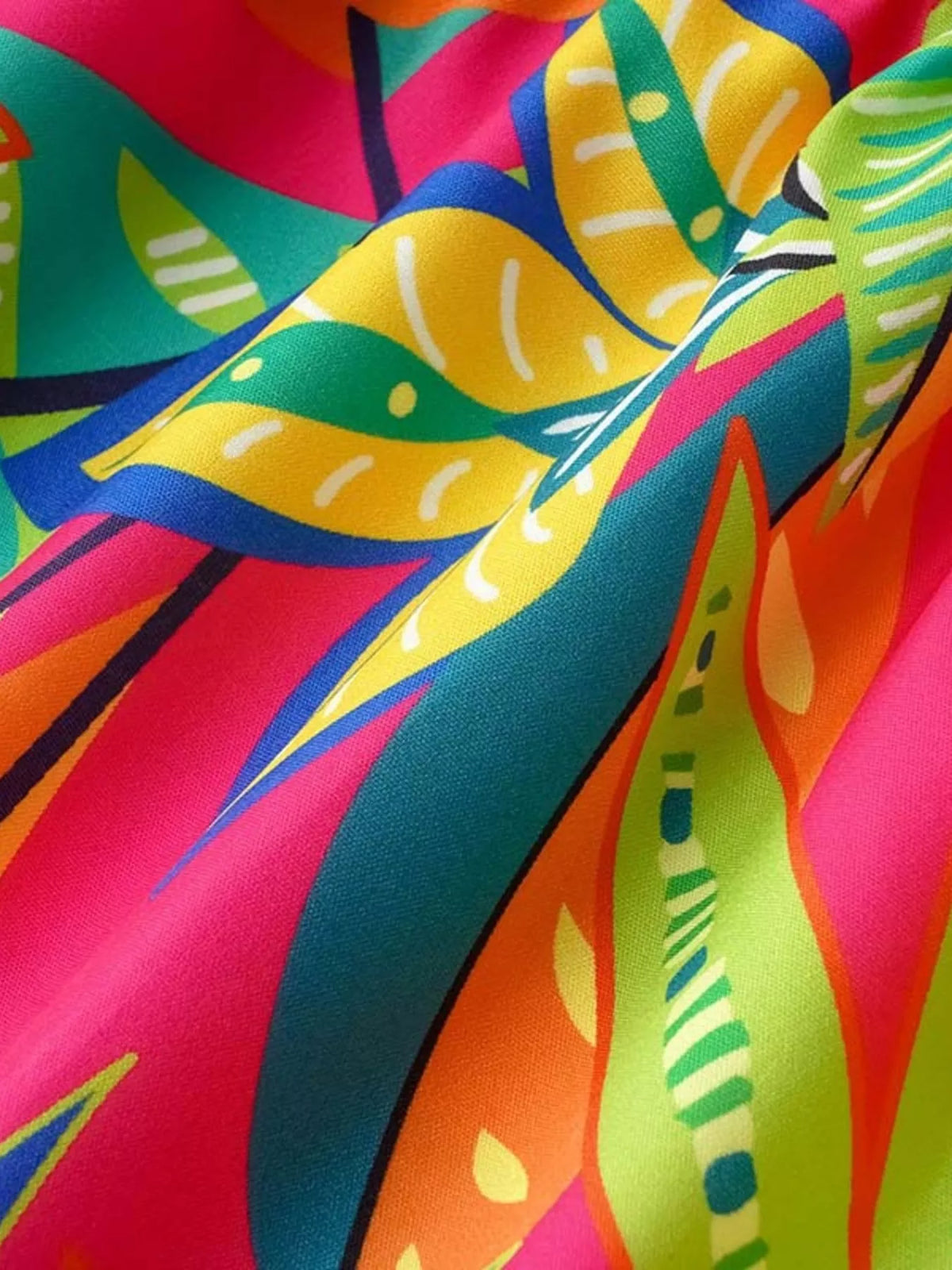 Tropical print smocked tie strap dress back view