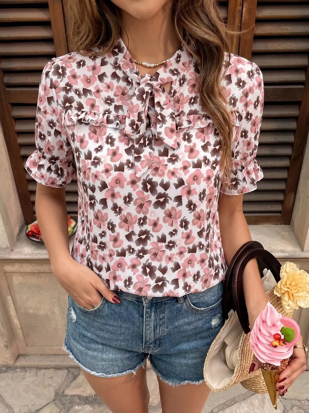 Pink floral tie neck ruffle blouse front view