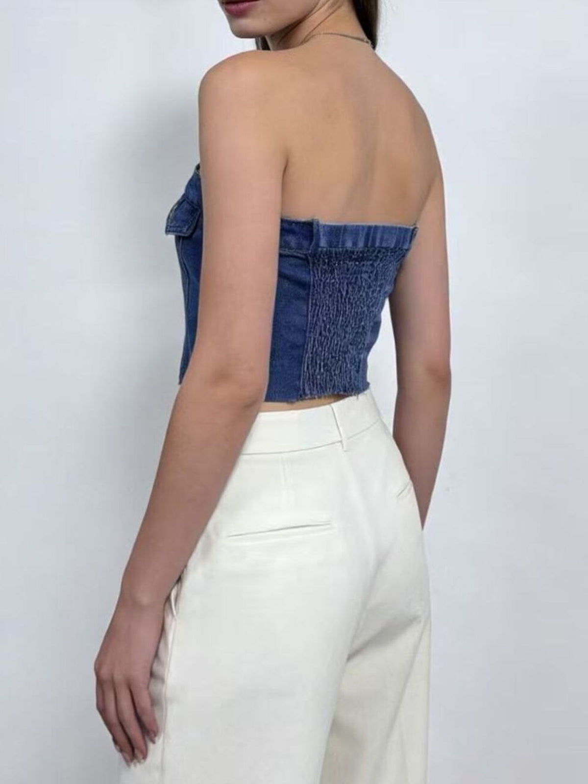 Denim tube top styled with high waisted bottoms
