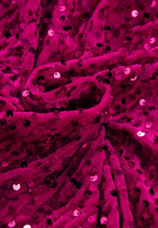 Deep rose sequin evening dress seated pose