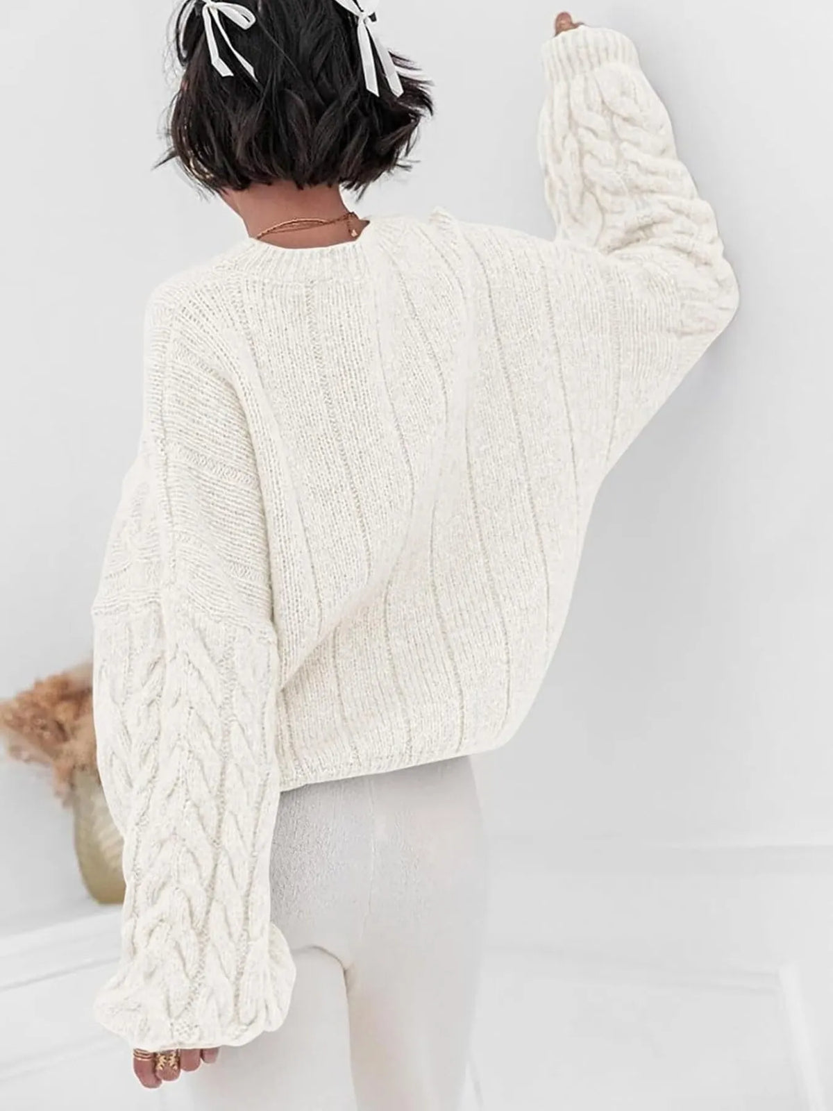 cable knit long sleeve sweater sleeve and cuff detail