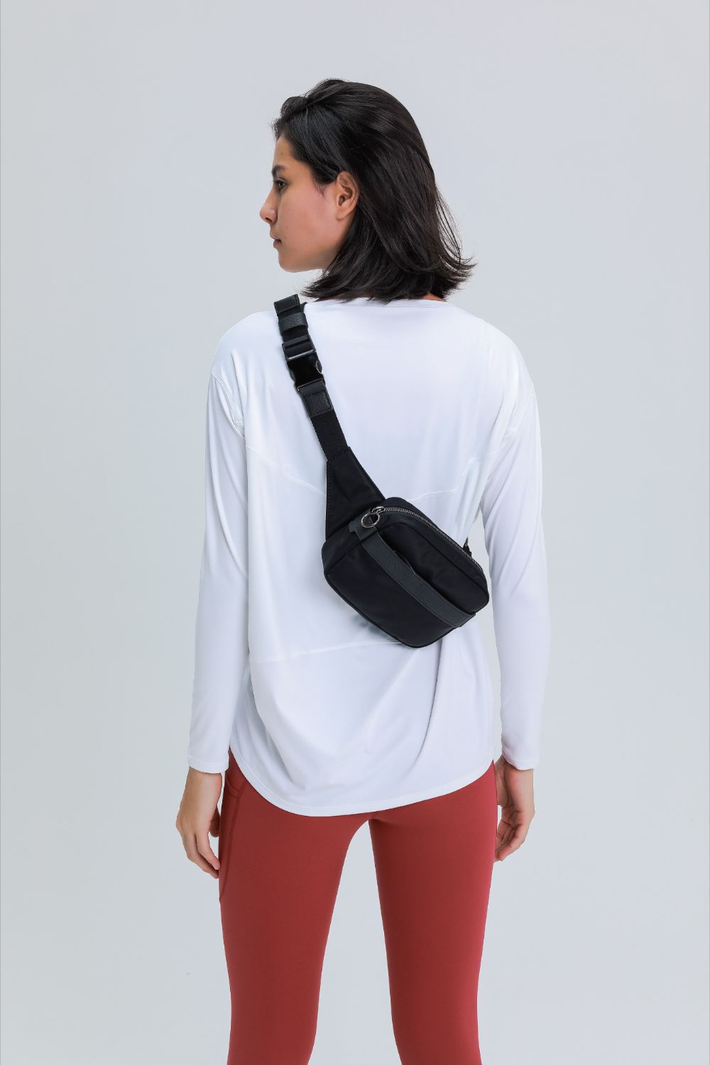 Loose fit active pullover top side view
