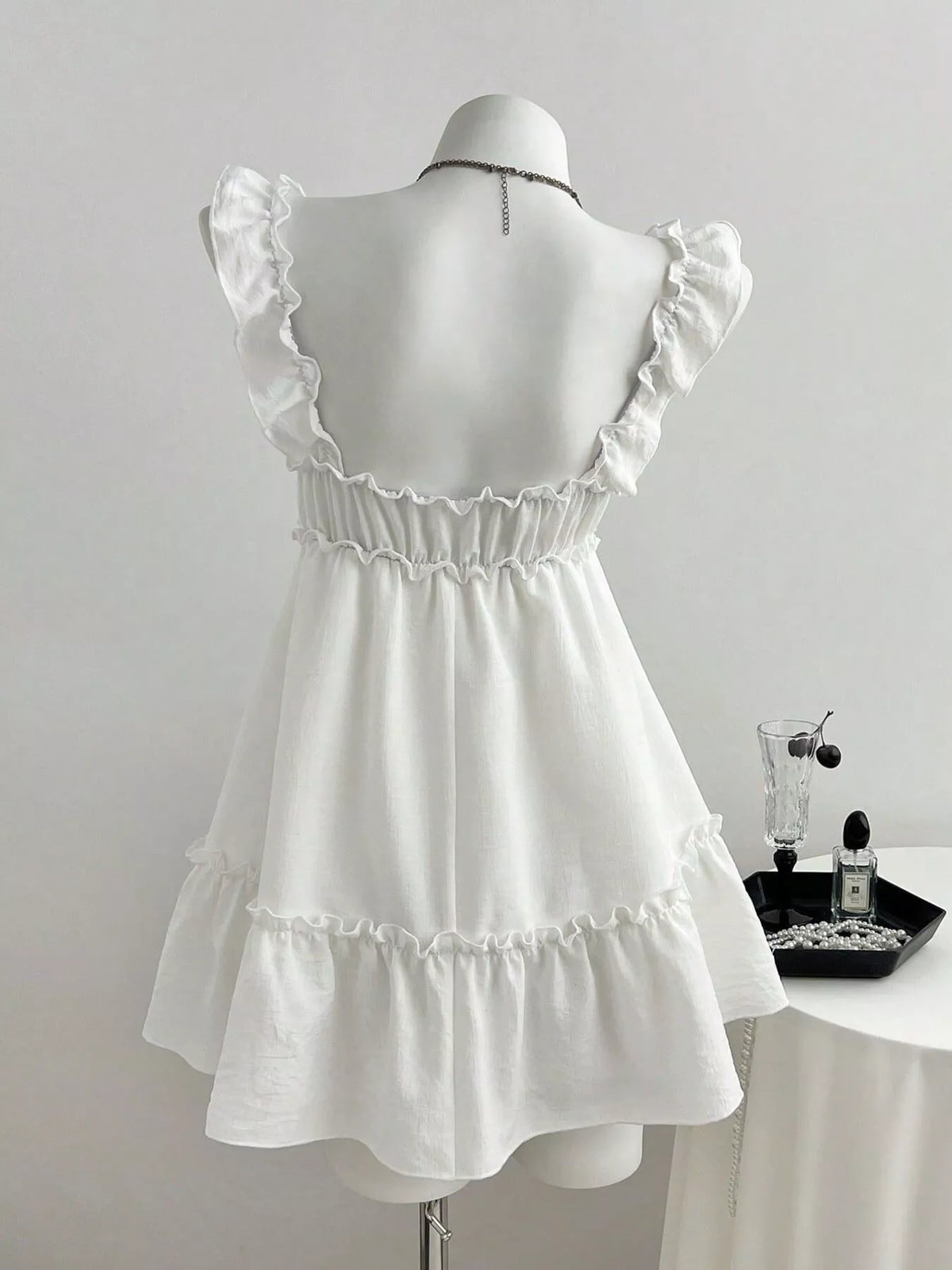 Full length styling shot of the frill mini dress