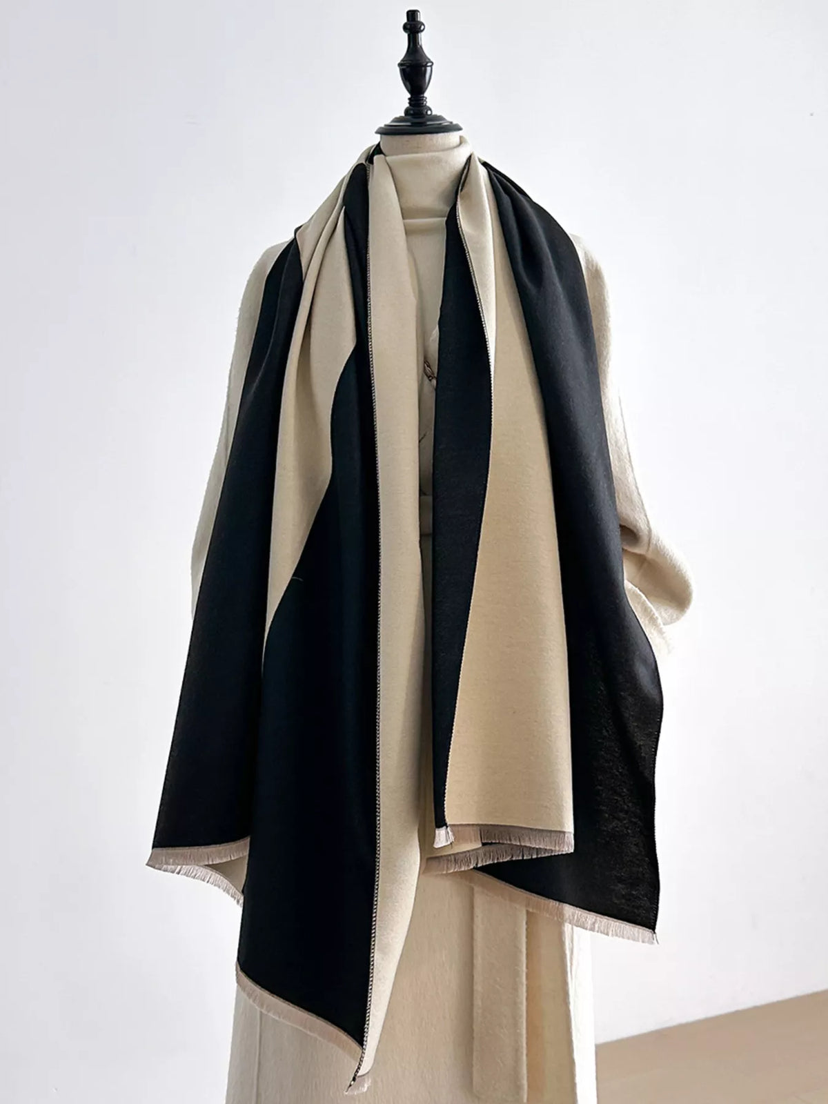 Raw hem edge detail on the two-tone scarf