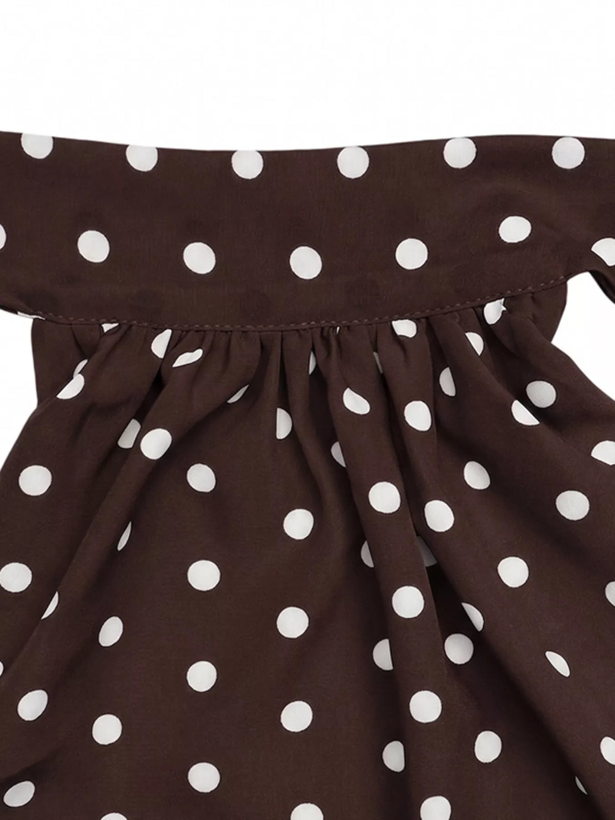 Polka dot mini dress on model in daylight
