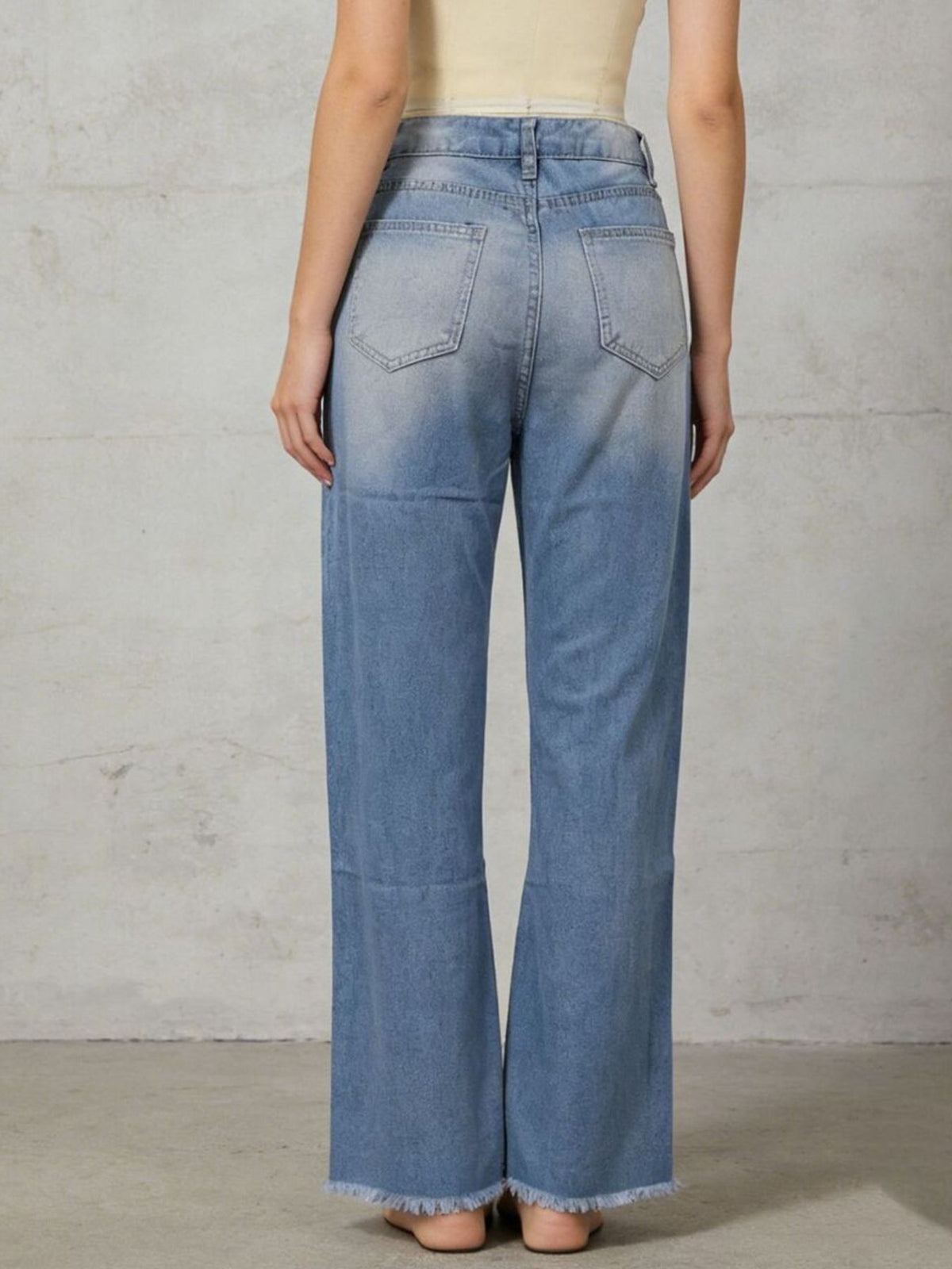 Raw frayed hem detail on bootcut jeans