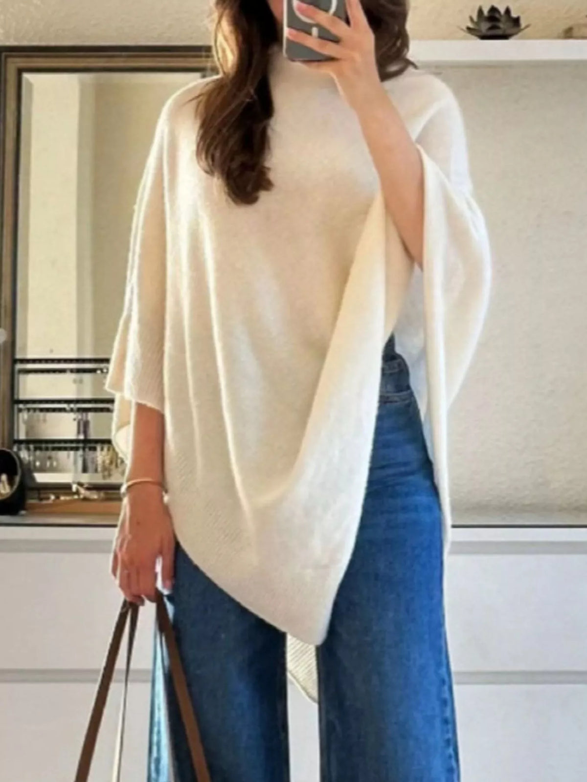 Turtleneck loose knit sweater poncho side drape detail