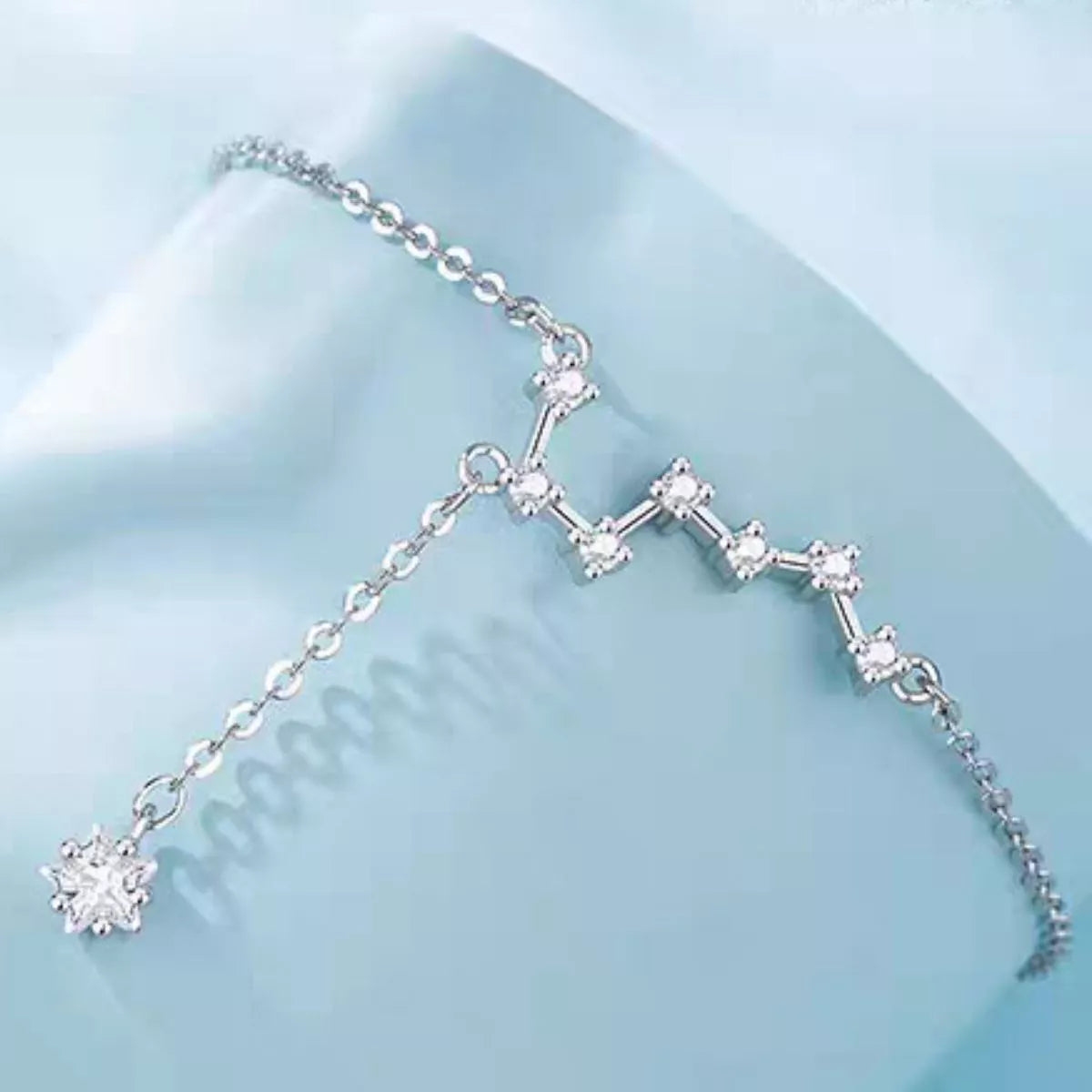 Close up of the zircon stones on the silver anklet chain