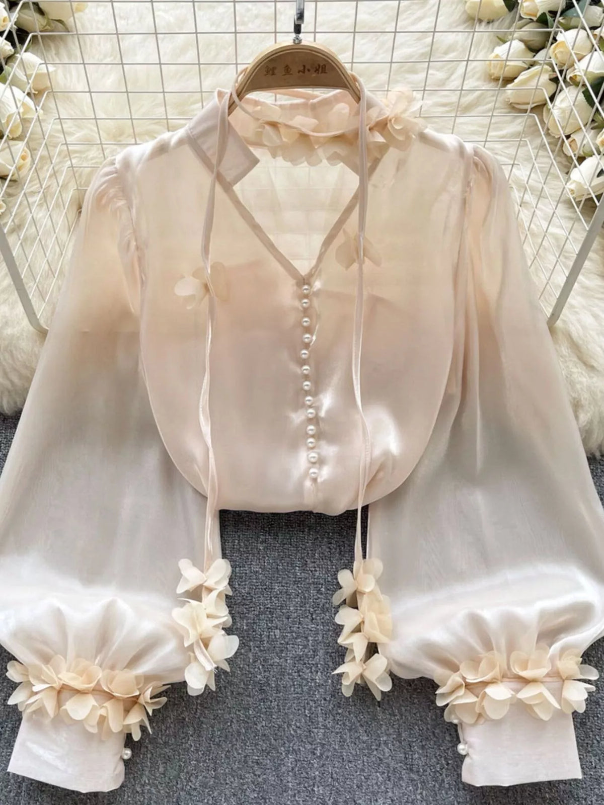 Sleeve and cuff detail on the sheer floral shirt