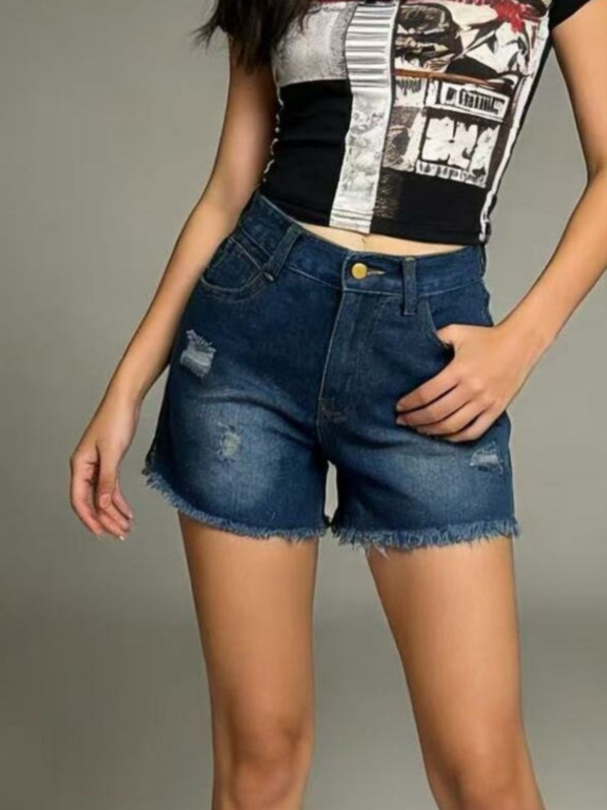 Denim shorts in dark blue styled with a casual top