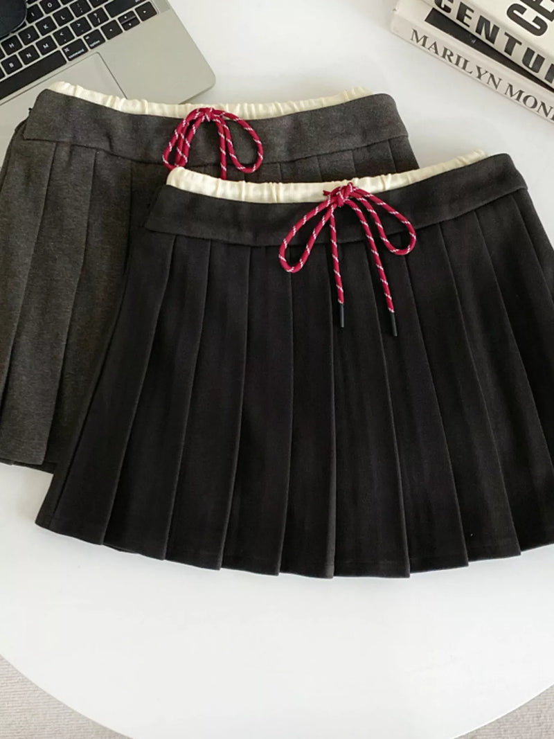 Black pleated mini skirt front view