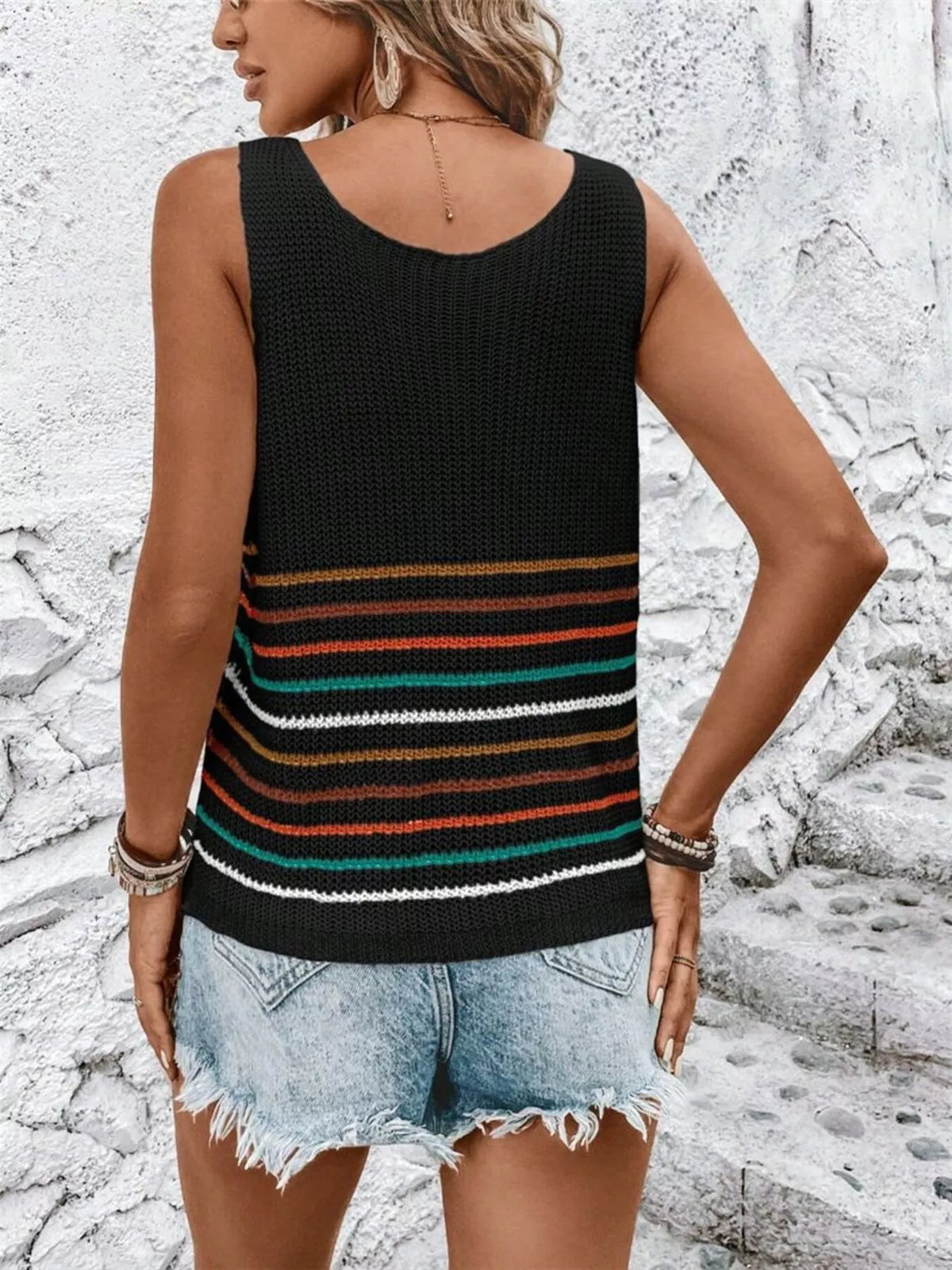 Preppy striped knit vest styled over a shirt