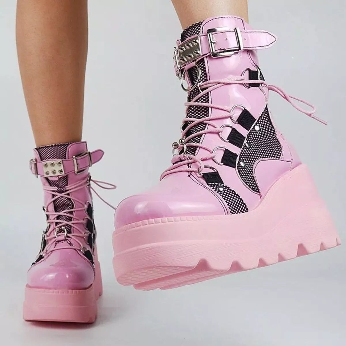 Lace up platform wedge boots worn with denim