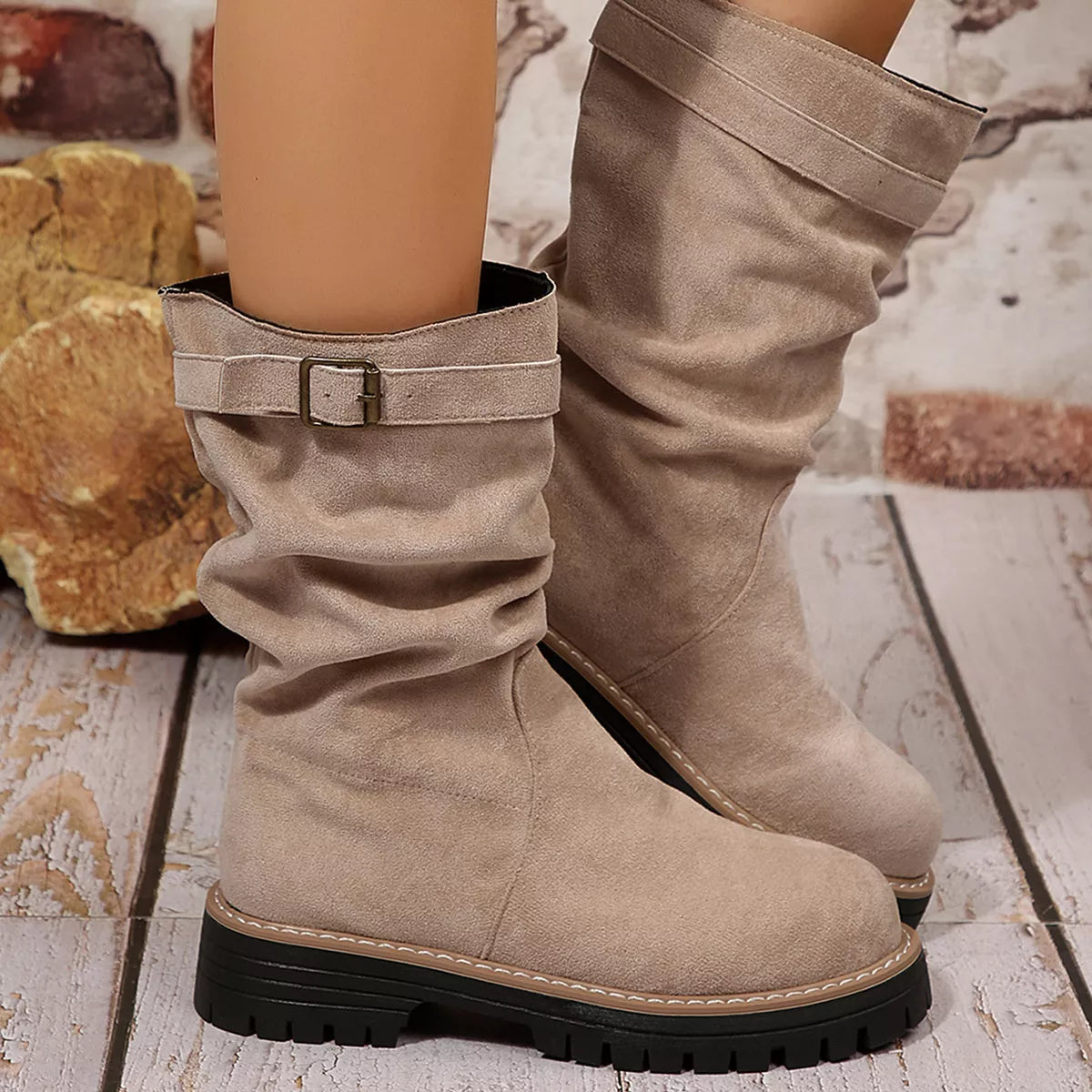 Buckle accent slouch boots heel detail